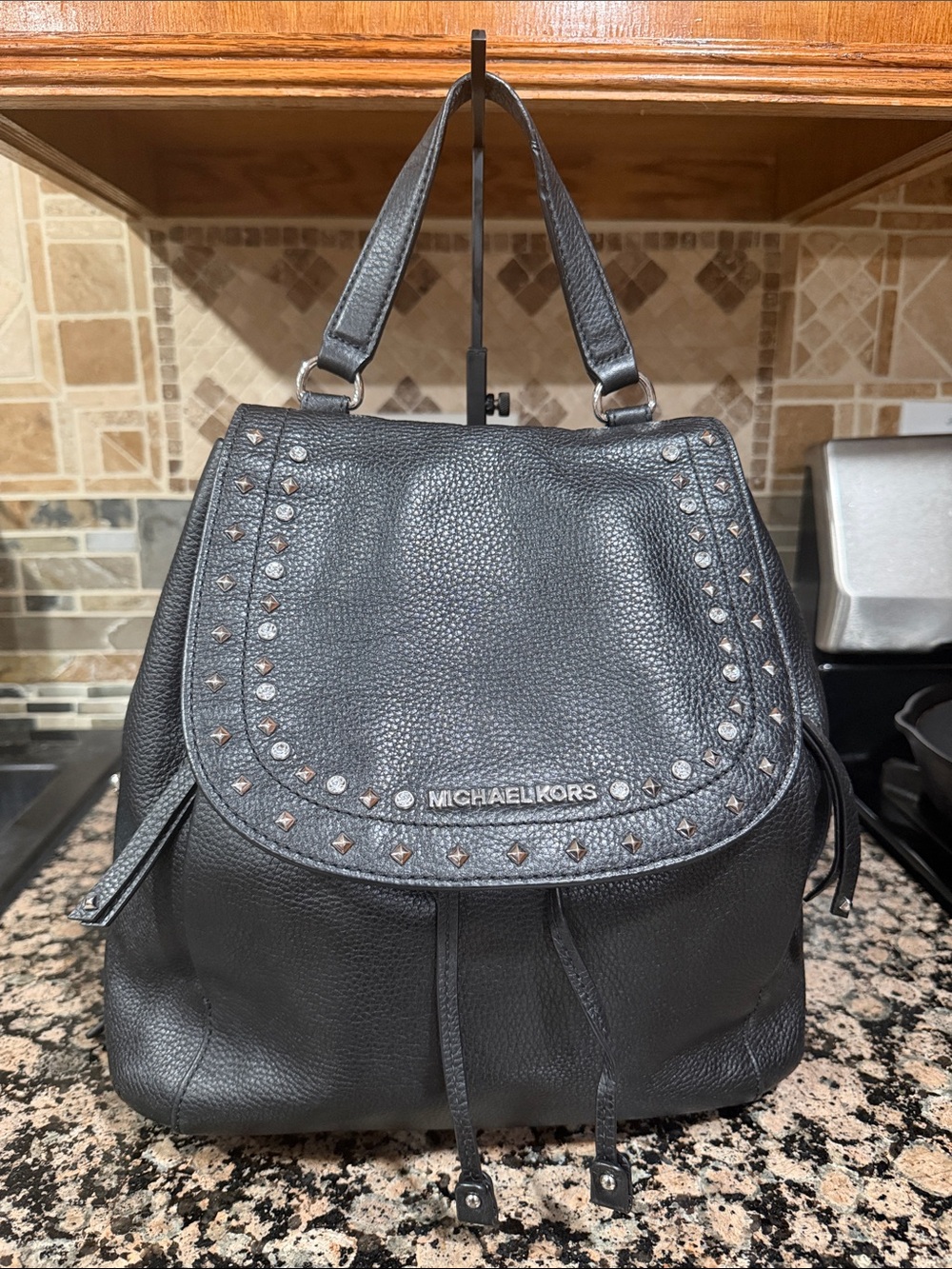 Michael Kors Black Pebbled Leather Studded Flap Backpack